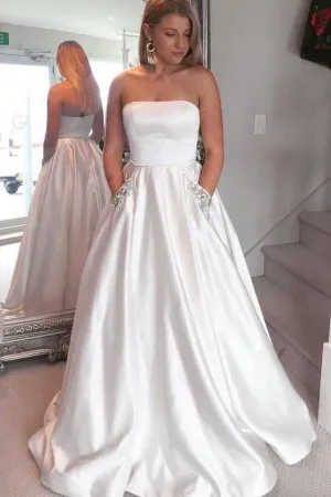 white satin strapless beaded pockets prom ballgown
