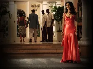 Caterina Murino salmon red evening formal dress in Movie Casino Royale