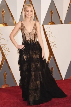 Jennifer Lawrence black tiered sheer lace on nude lining red carpet dress at Oscars