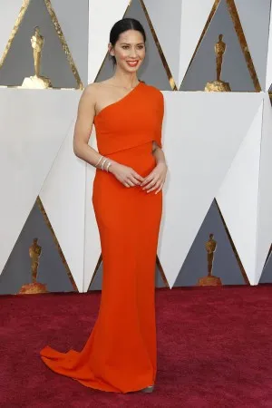 Olivia Munn orange one shoulder red carpet dress at Oscars 2016