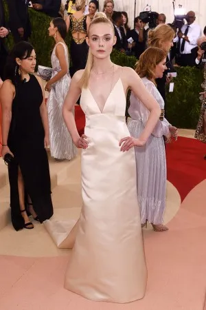 Elle Fanning nude satin simple red carpet dress at Met Gala 2016
