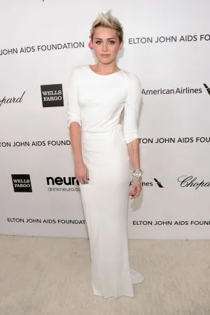 Miley Cyrus white jersey red carpet dress at 2013 Elton John AIDS Foundation Oscars Party