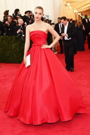 Arizona Muse gorgeous red satin red carpet dress at Met Gala 2014