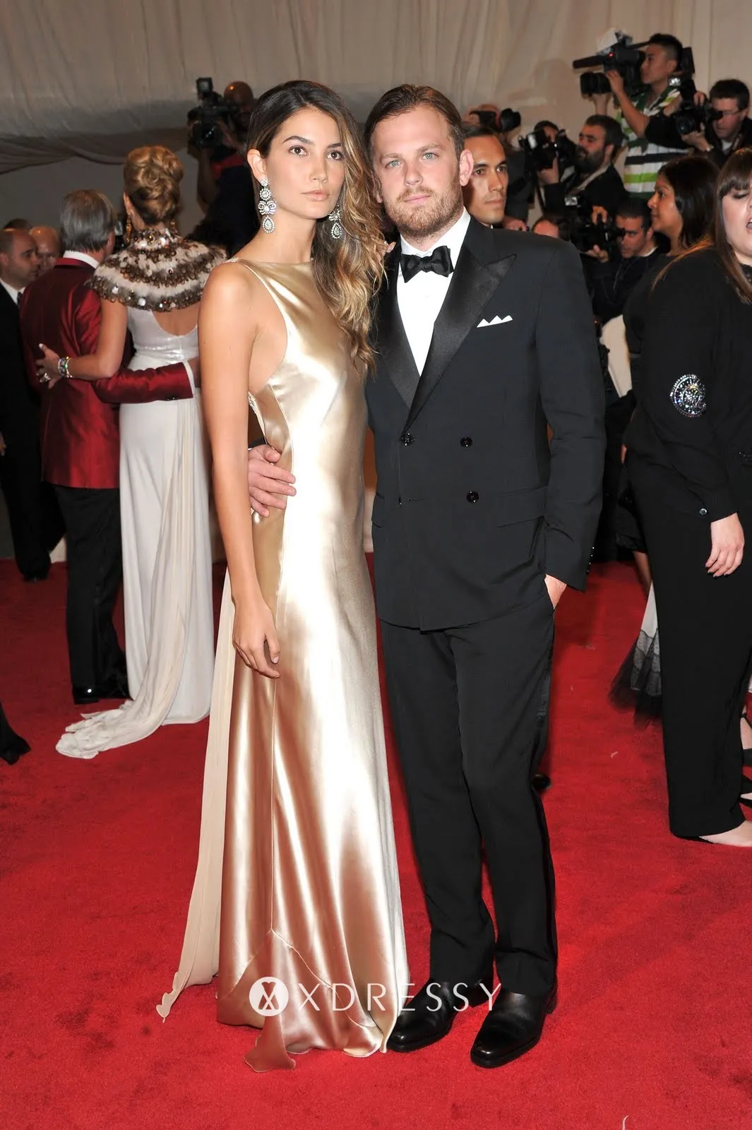 Lily Aldridge gold satin fit and flare red carpet dress