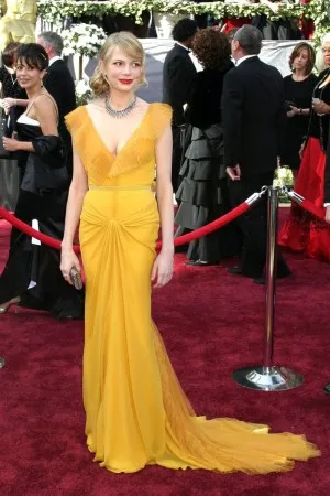 Michelle Williams ruffled yellow red carpet dress at Oscars 2006