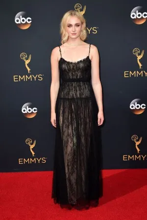 Sophie Turner illusion black lace overlay with nude lining red carpet dress at Emmys 2016