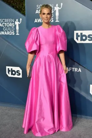 Molly Sims cut a vibrant figure in a fuchsia satin crew neck long evening gown at the 2020 SAG Awards