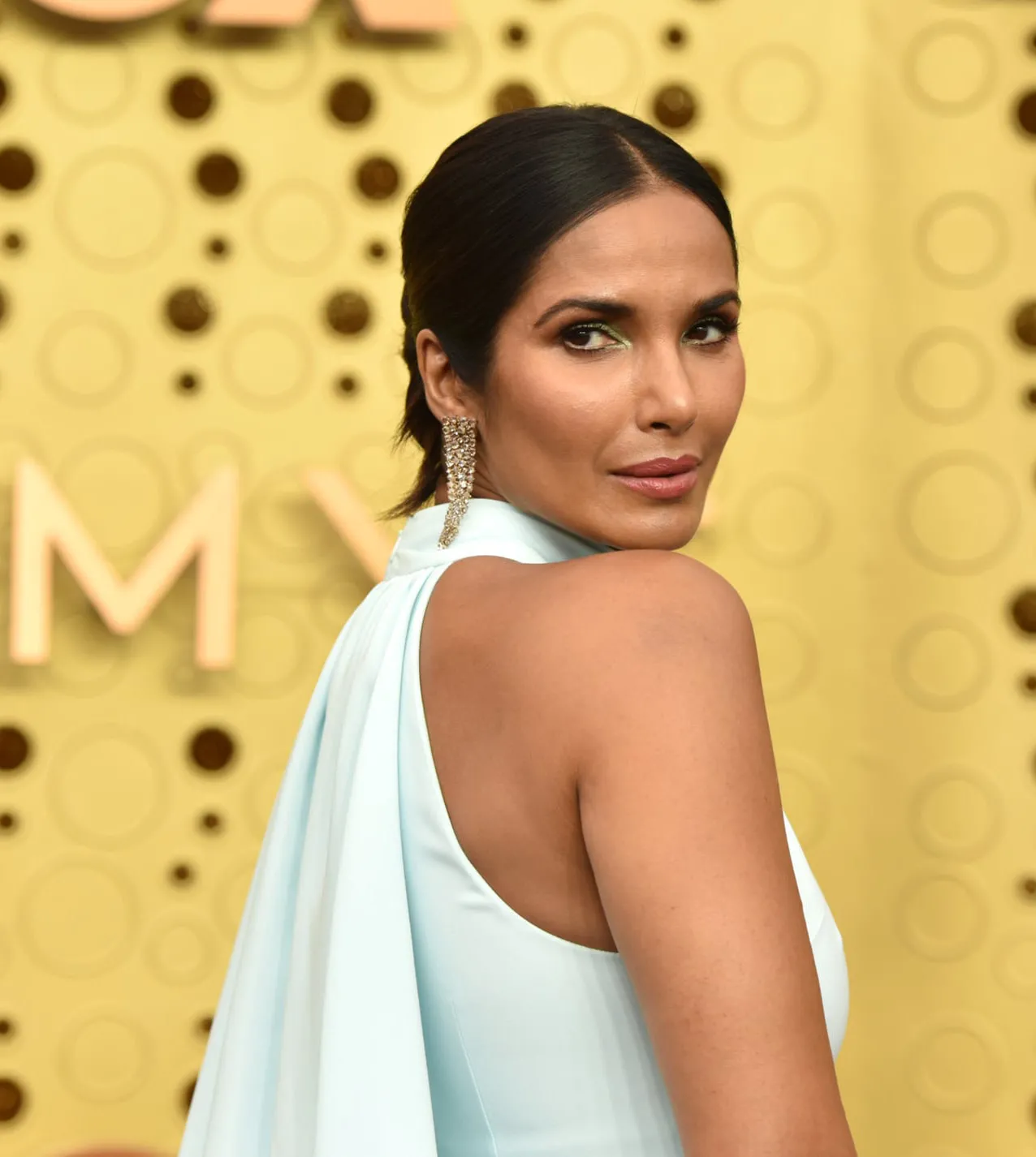 Padma Lakshmi light blue dress with halter neckline at the 2019 Emmys Padma Lakshmi light blue dress with halter neckline at the 2019 Emmys