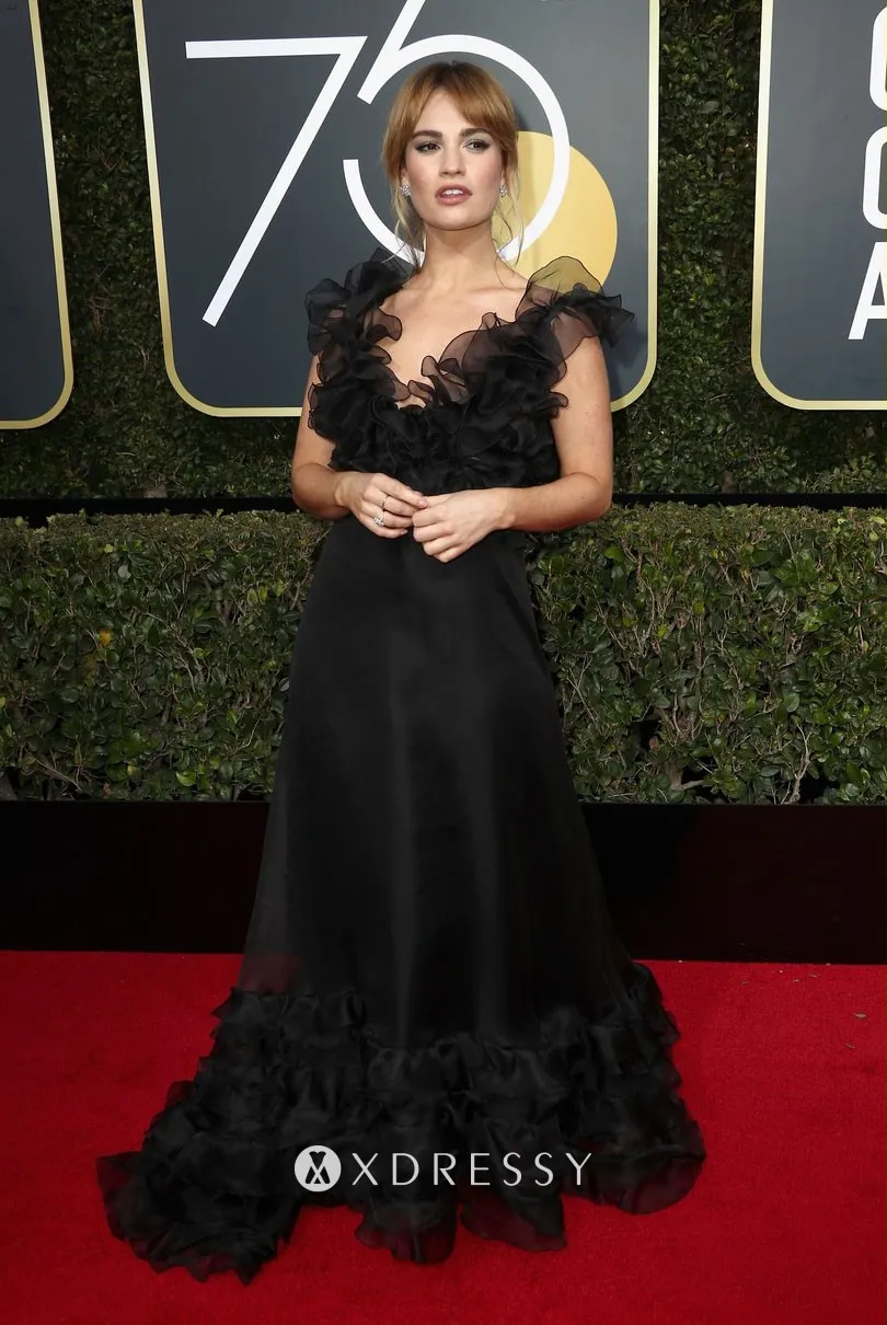 Lily James ruffled black satin and organza red carpet prom dress