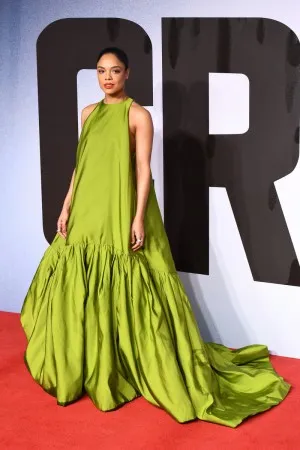 Tessa Thompson sage green satin red carpet puffy gown at European Premiere of Creed II