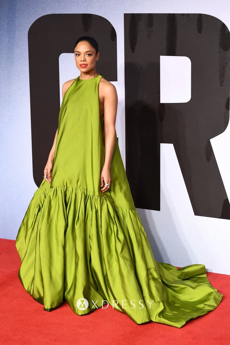 Tessa Thompson sage green satin red carpet puffy gown at European Premiere of Creed II