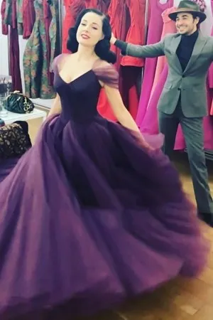 Dita Von Teese purple tulle ball gown with cap sleeves and V neckline