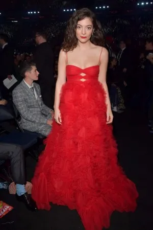 Lorde in a red gown attends the 60th Annual GRAMMY Awards 2018