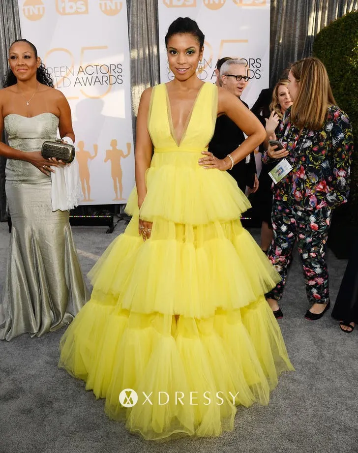 Susan Kelechi Watson looked stunning in a voluminous yellow tiered tulle gown