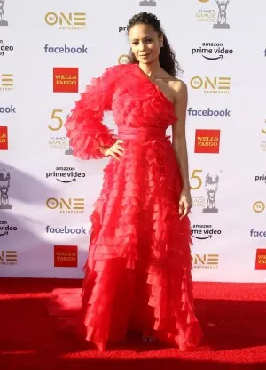 Thandie Newton ultra feminine tiered one shoulder princess red carpet gown with one sleeve at 2019 NAACP Image Awards