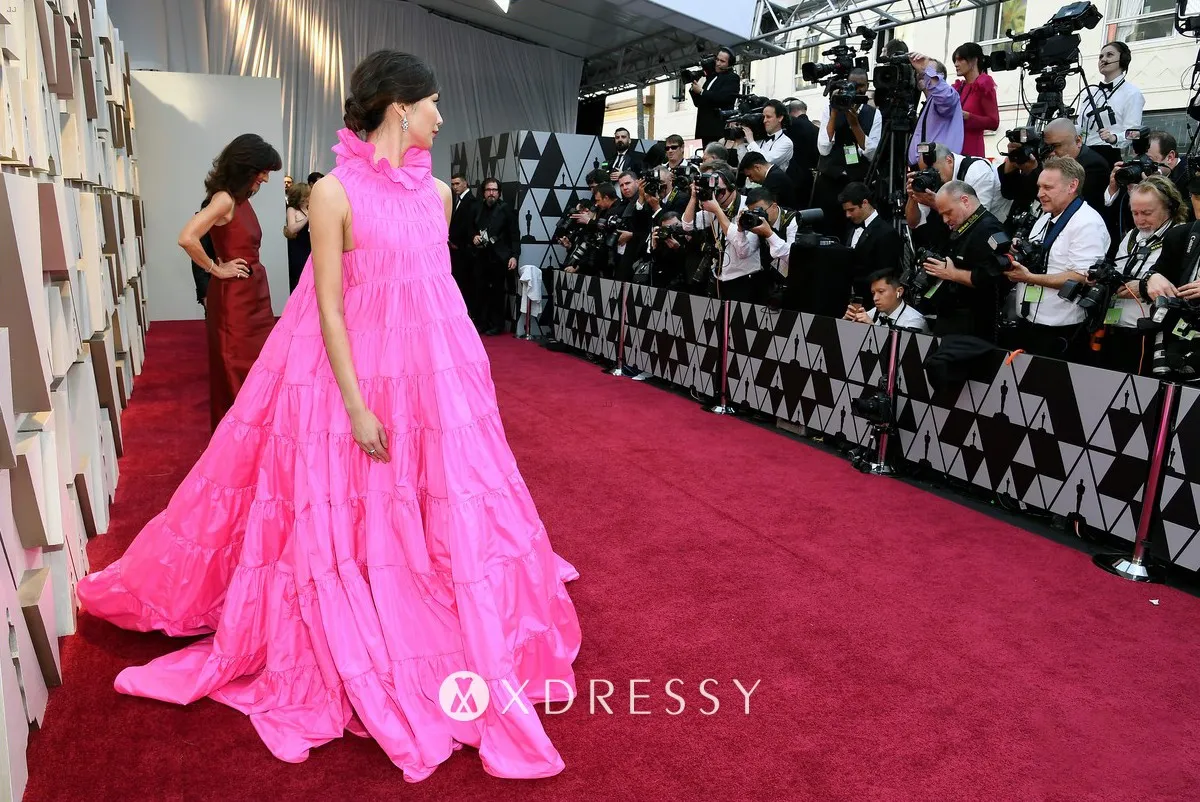 Gemma Chan sleeveless ruffled fuchsia red carpet ball gown Gemma Chan sleeveless ruffled fuchsia red carpet ball gown