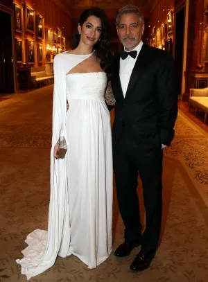 Amal Clooney white one sleeve caped evening dress at the Princes Trust dinner