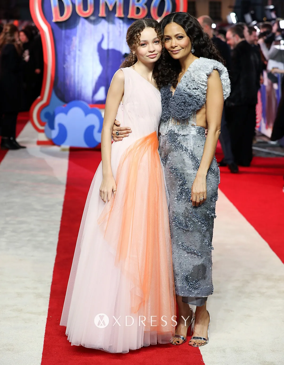 Nico Parker looked princessy in a pink and coral one shoulder tulle A line long celebrity gown