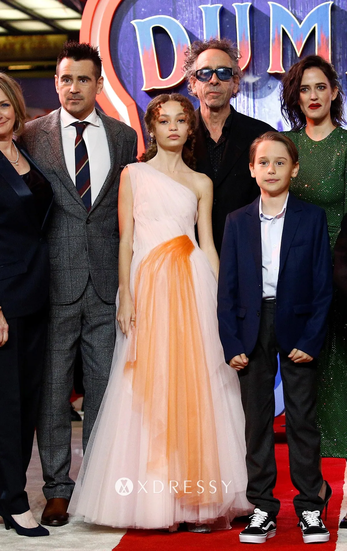 Nico Parker looked princessy in a pink and coral one shoulder tulle gown on premiere of Dumbo 2019
