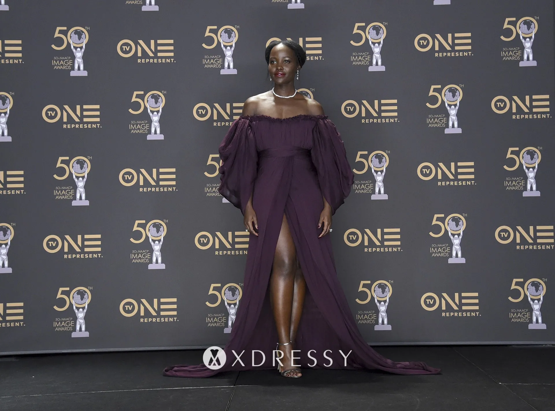 Lupita Nyongo off the shoulder evening dress at the 2019 NAACP Image Awards Lupita Nyongo off the shoulder evening dress at the 2019 NAACP Image Awards