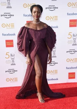 Lupita Nyongo off the shoulder slit evening dress at the 2019 NAACP Image Awards red carpet