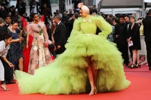 Deepika Padukone in a voluminous ruffled tiered lime green tulle high low ball gown at the 2019 Cannes Film Festival