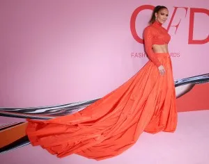 Jennifer Lopez orange glitter and taffeta two piece long train formal dress at the 2019 CFDA red carpet