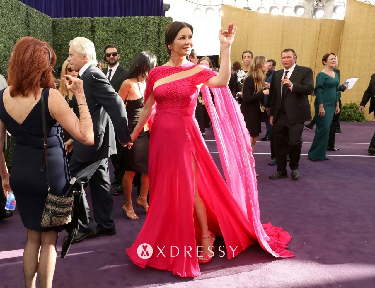 Catherine Zeta Jones in a hot pink caped dress at 2019 Emmy Awards