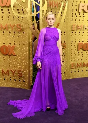 Julia Garner in an asymmetrical pleated regency sheer chiffon one sleeve cut out long prom dress at the 2019 Emmy Awards