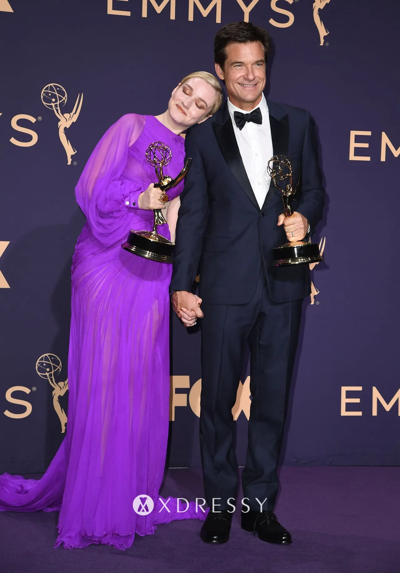 Julia Garner in an asymmetrical pleated regency sheer chiffon one sleeve cut out long prom dress Julia Garner in an asymmetrical pleated regency sheer chiffon one sleeve cut out long prom dress