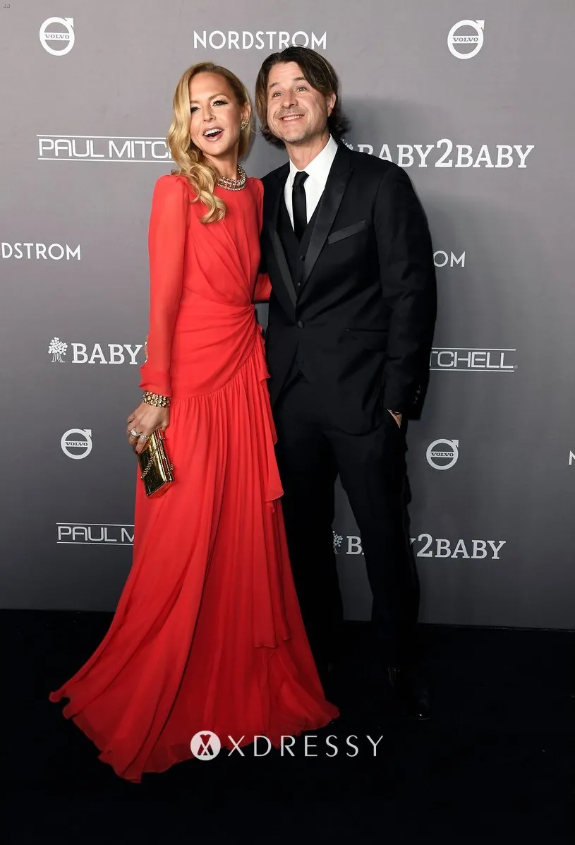 Rachel Zoe in a long sleeve red chiffon vintage inspired formal dress at the 2019 Baby2Baby Gala