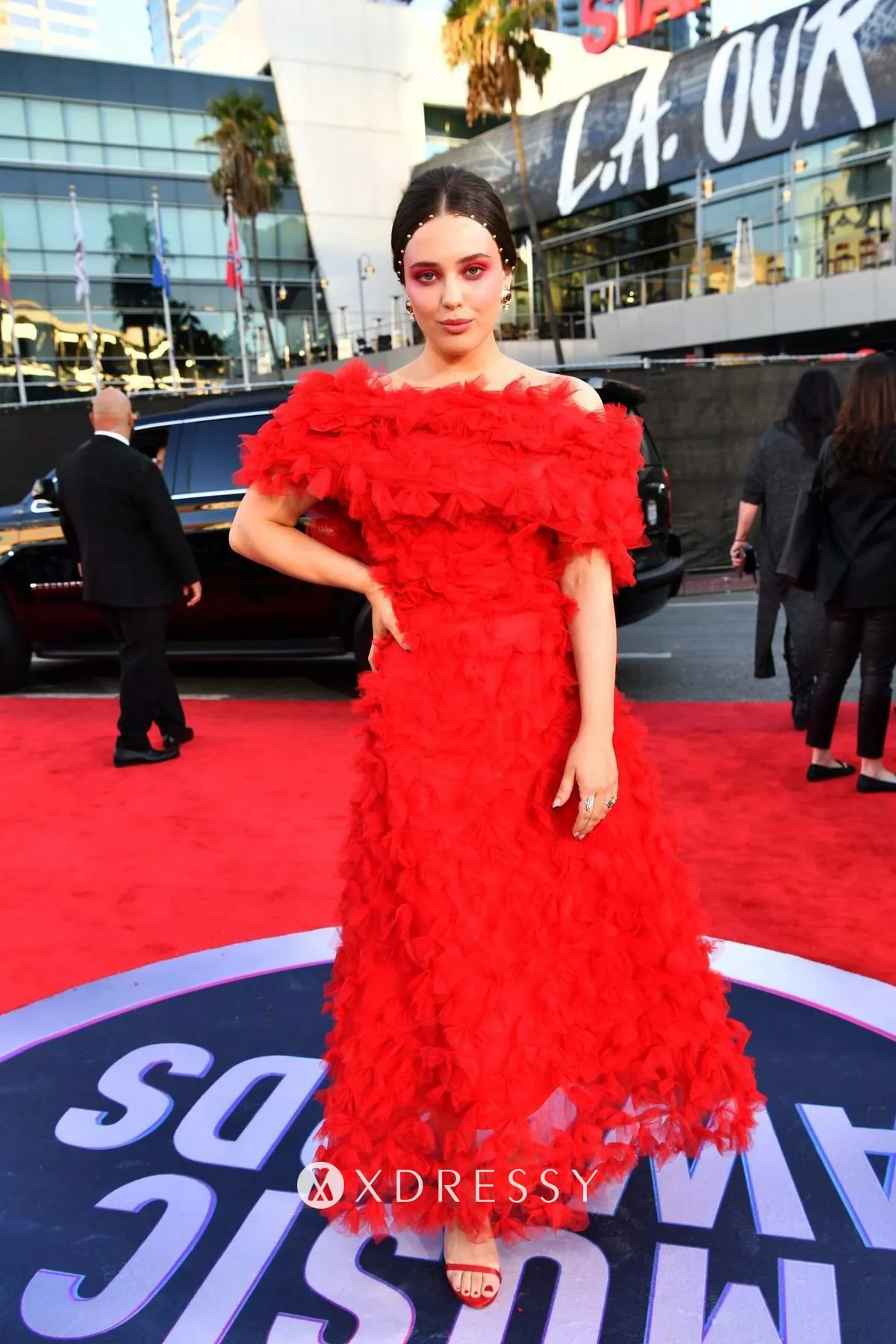Katherine Langford looks beautiful in a red tulle off the shoulder fashion prom gown at the 2019 American Music Awards Katherine Langford looks beautiful in a red tulle off the shoulder fashion prom gown at the 2019 American Music Awards