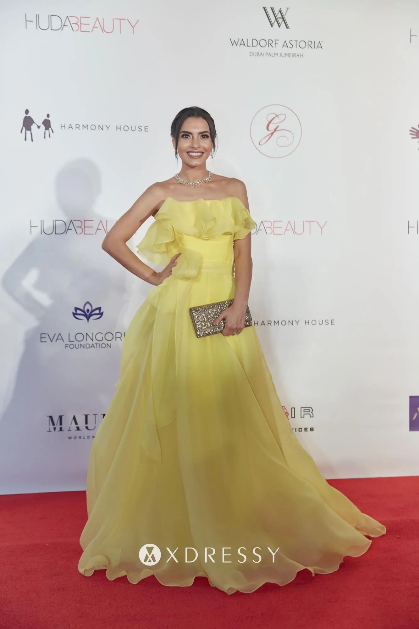 Carmen Soliman in a strapless ruffled yellow organza evening prom formal dress at the Global Gift Gala Dubai Carmen Soliman in a strapless ruffled yellow organza evening prom formal dress at the Global Gift Gala Dubai