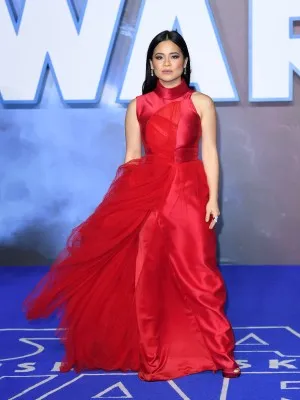 Kelly Marie Tran in a high neck red satin and tulle gown at the European premiere of Star Wars The Rise of Skywalker