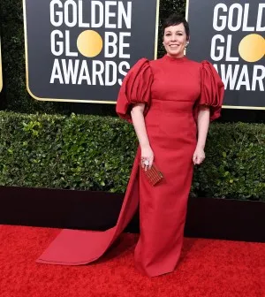 Olivia Colman in a dark red column dress with balloon sleeves and a long train for the 2020 Golden Globes red carpet