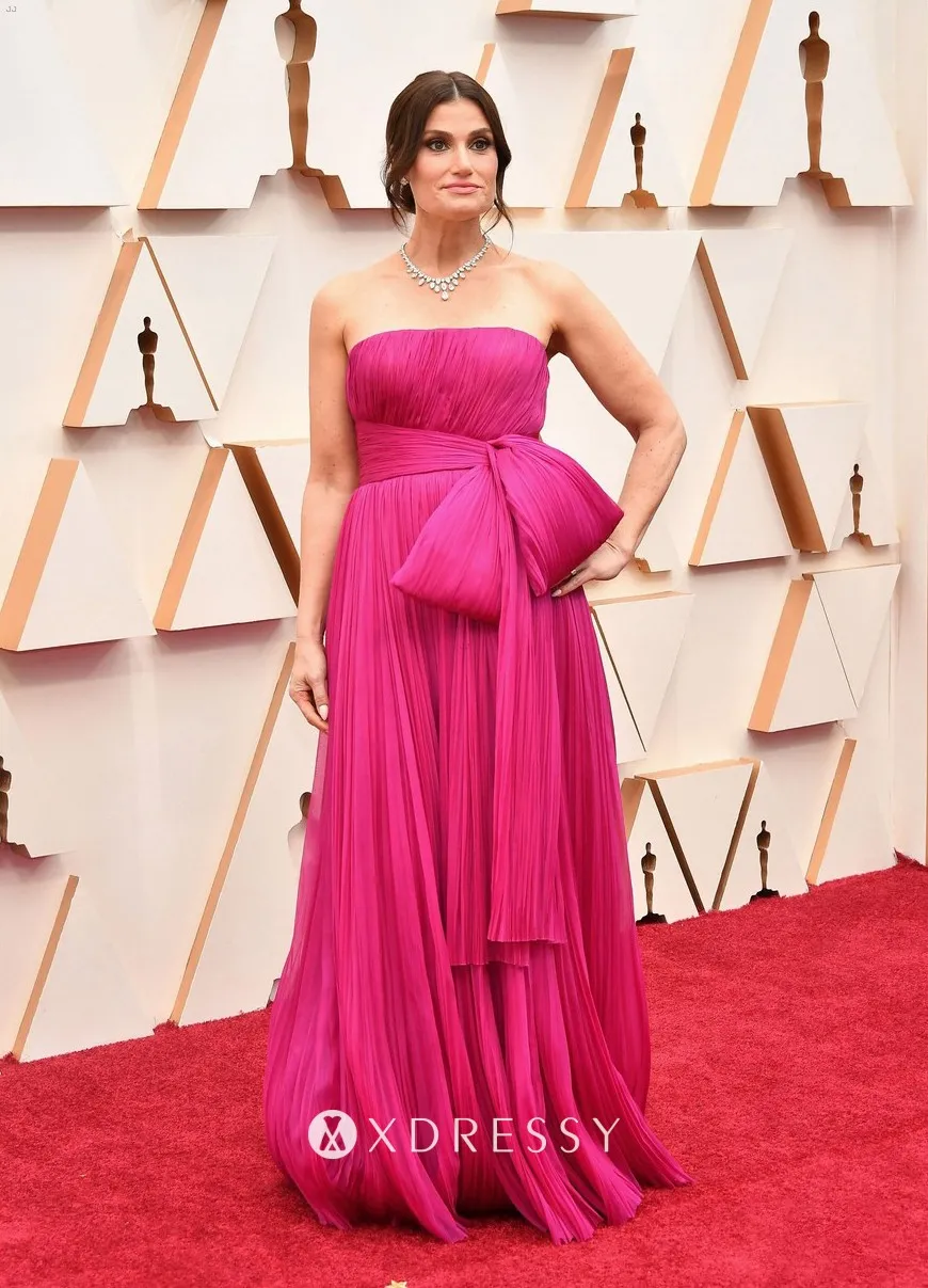 Idina Menzel looked lovely in a strapless pleated empire waist A line long fuchsia formal gown Idina Menzel looked lovely in a strapless pleated empire waist A line long fuchsia formal gown