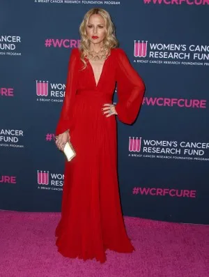 Rachel Zoe in a red chiffon plunging V neck dress with long sleeves at the 2020 Unforgettable Evening Gala red carpet