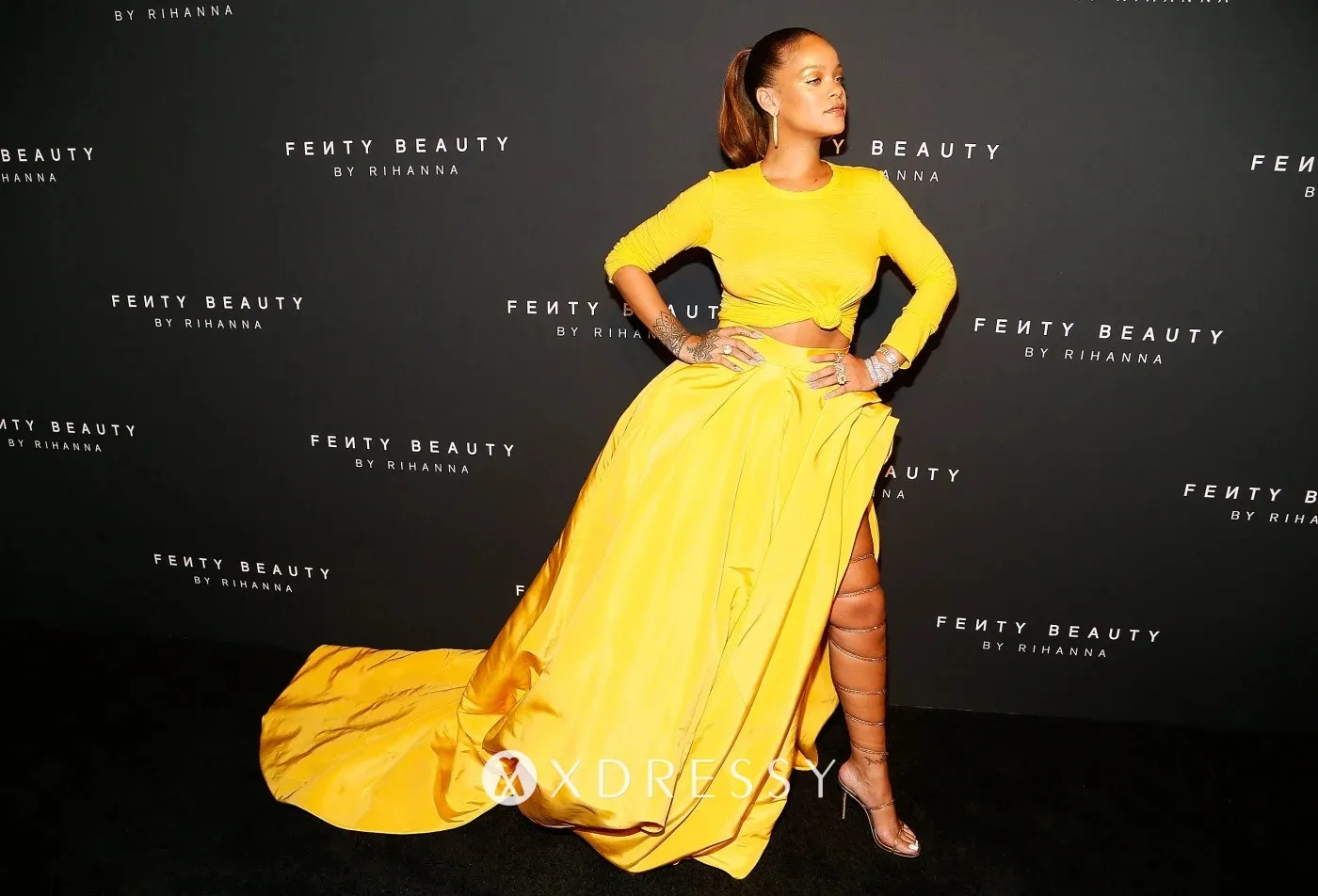 Rihanna wears a 2 piece yellow ball gown at the launch of her Fenty Beauty makeup line