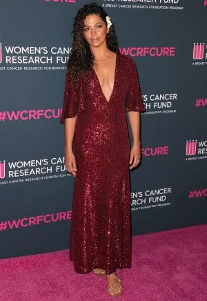 Camila Alves in a dark red sequin dress featuring a plunging neckline at the 2020 Unforgettable Evening Gala