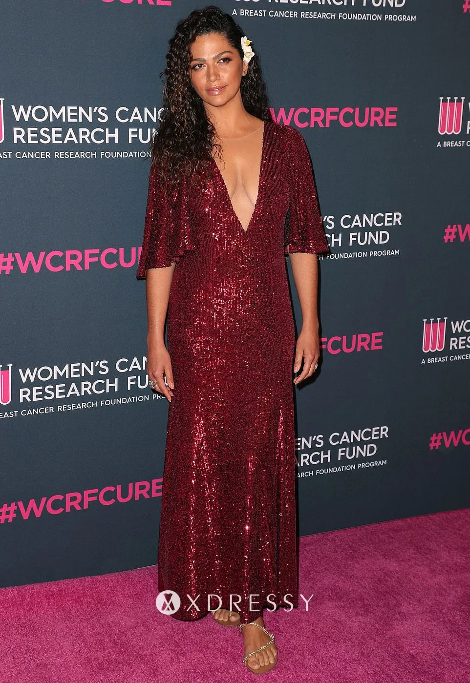 Camila Alves in a dark red sequin dress featuring a plunging neckline at the 2020 Unforgettable Evening Gala