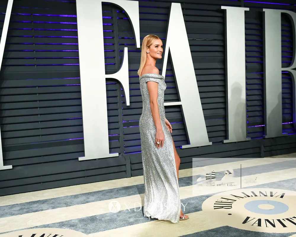 Rosie Huntington Whiteley in a sparkly silver dress at the 2019 Vanity Fair Oscar Party in Beverly Hills