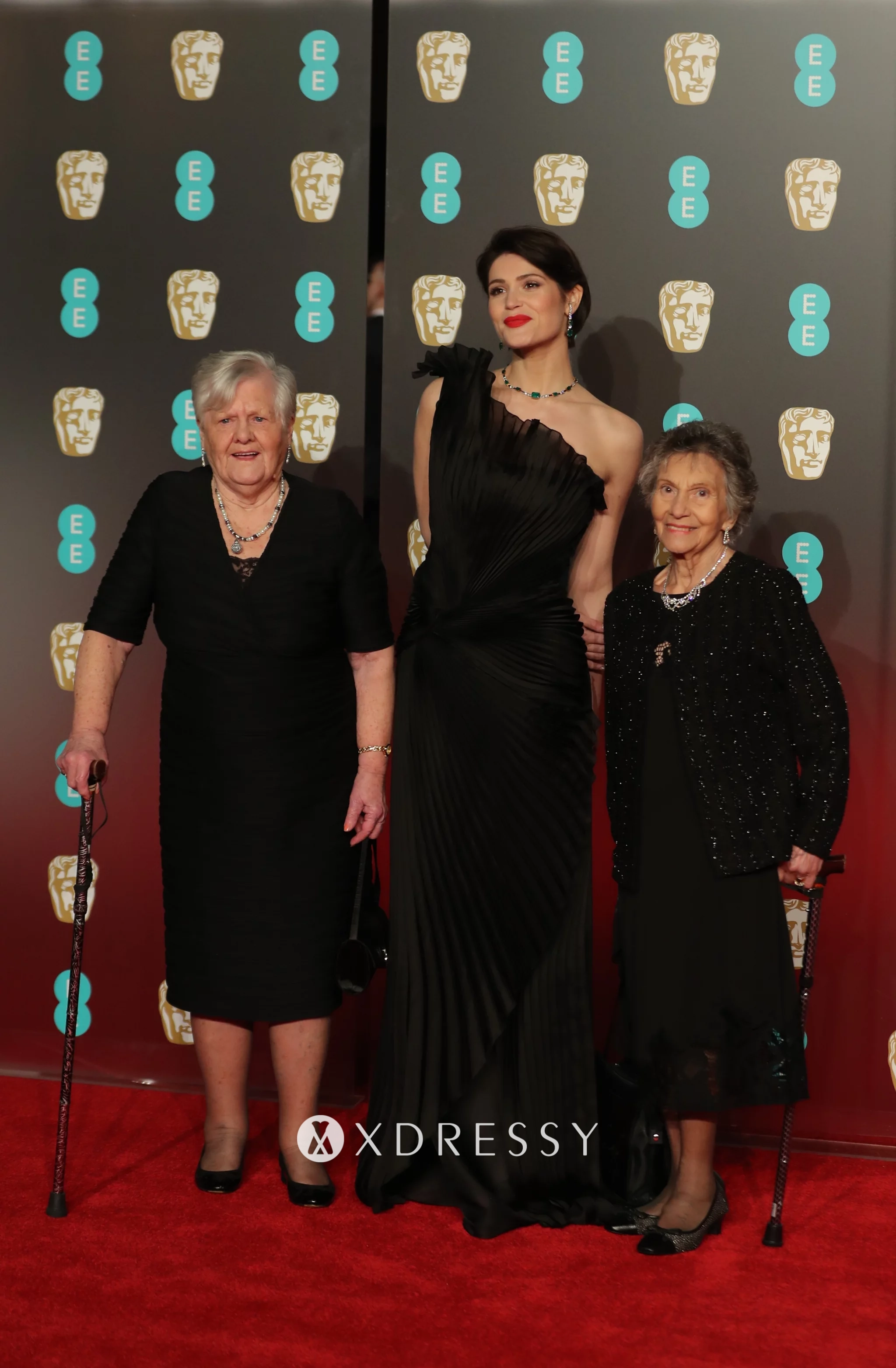 Gemma Arterton black pleated one shoulder formal dress on the 2018 BAFTAs red carpet Gemma Arterton black pleated one shoulder formal dress on the 2018 BAFTAs red carpet
