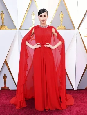 Sofia Carson red chiffon caped evening gown 2018 Oscars