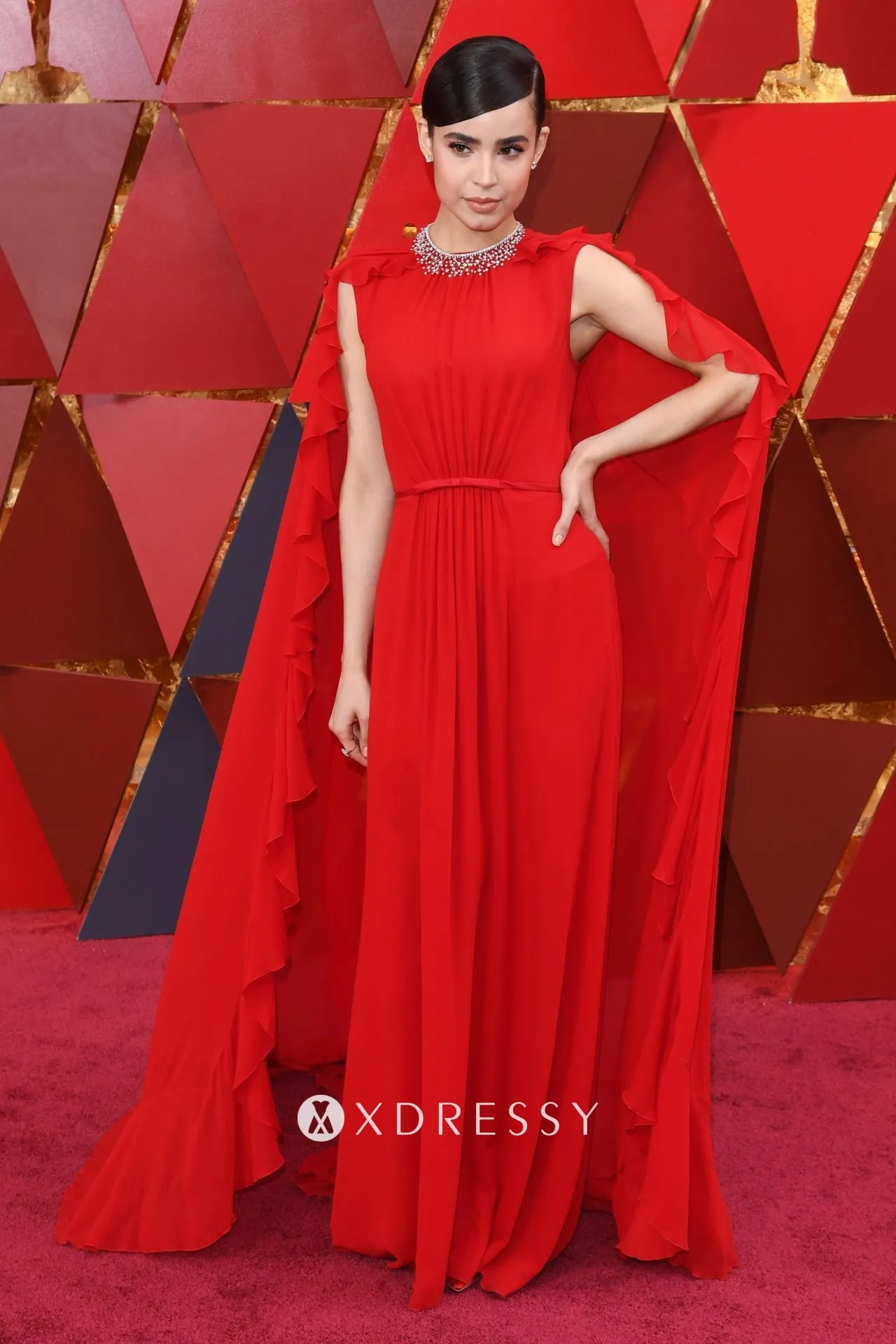 Sofia Carson red chiffon caped formal gown Sofia Carson red chiffon caped formal gown
