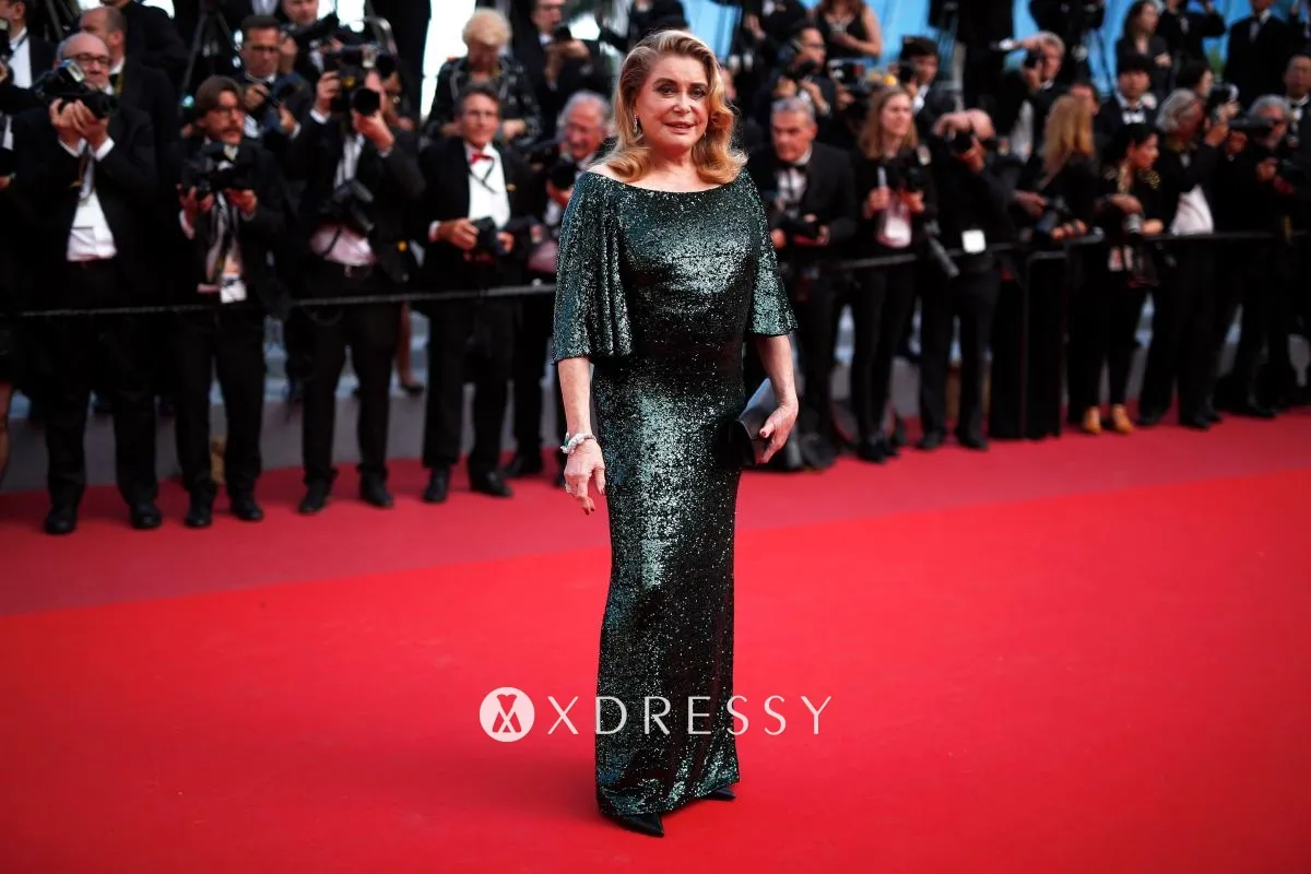 Catherine Deneuve dark green sequin red carpet gown