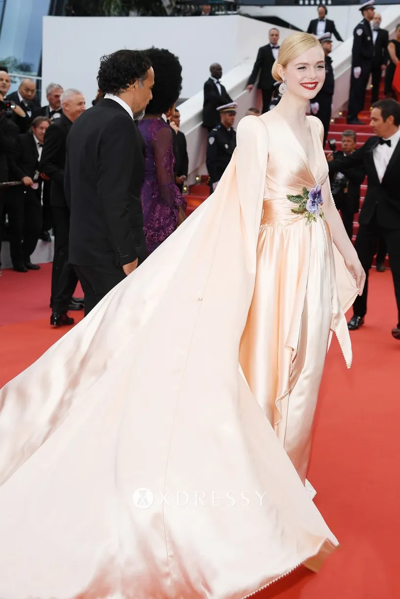 Elle Fanning champagne v neck caped red carpet dress Elle Fanning champagne v neck caped red carpet dress