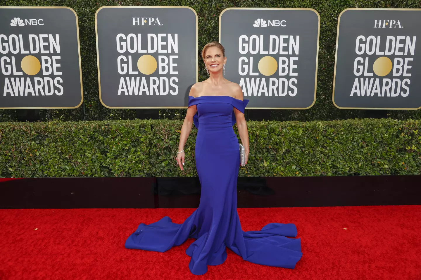 Natalie Morales royal blue off shoulder evening dress at 2020 Golden Globes