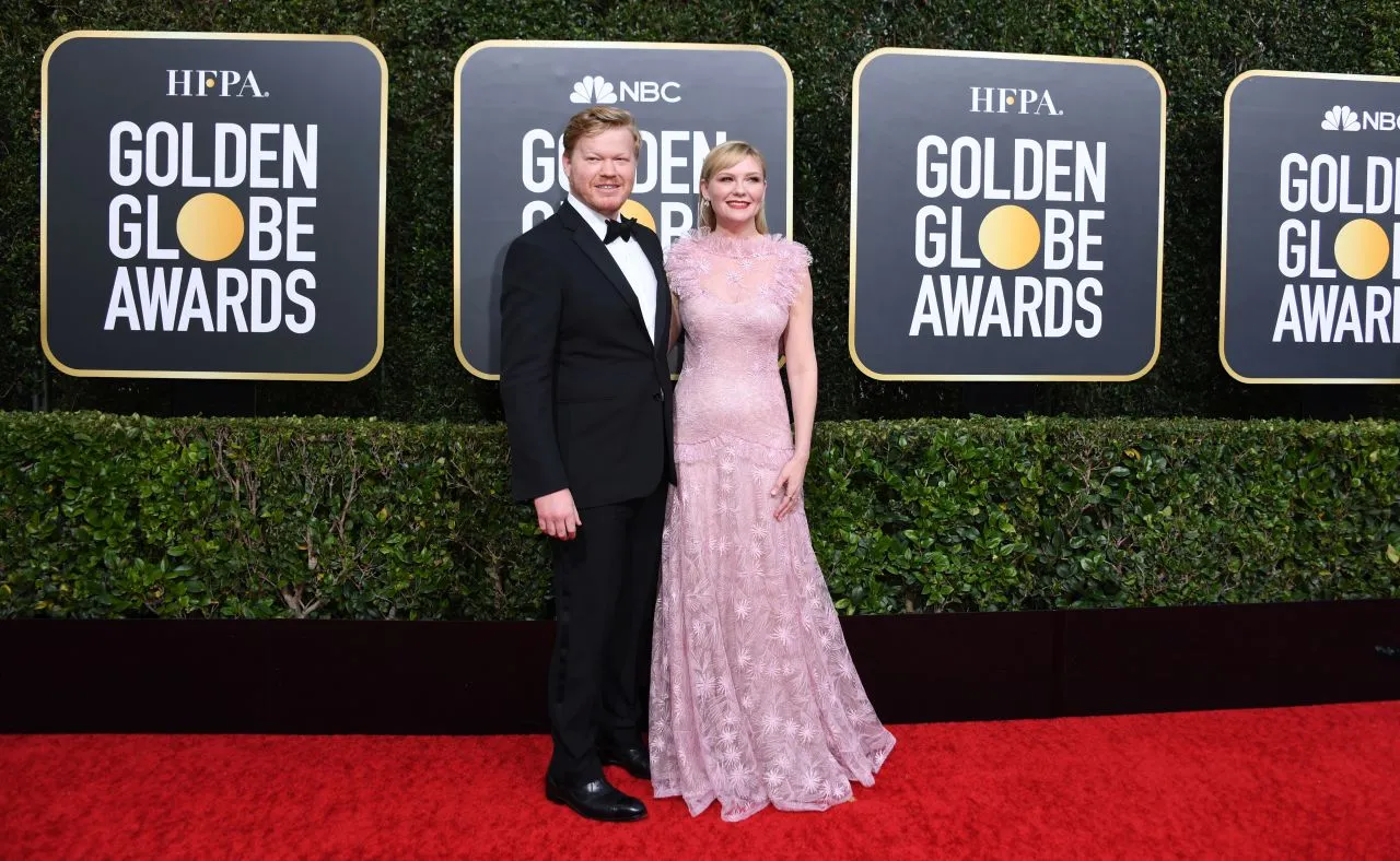 Kirsten Dunst pink lace ruffled formal gown on 2020 Golden Globes red carpet