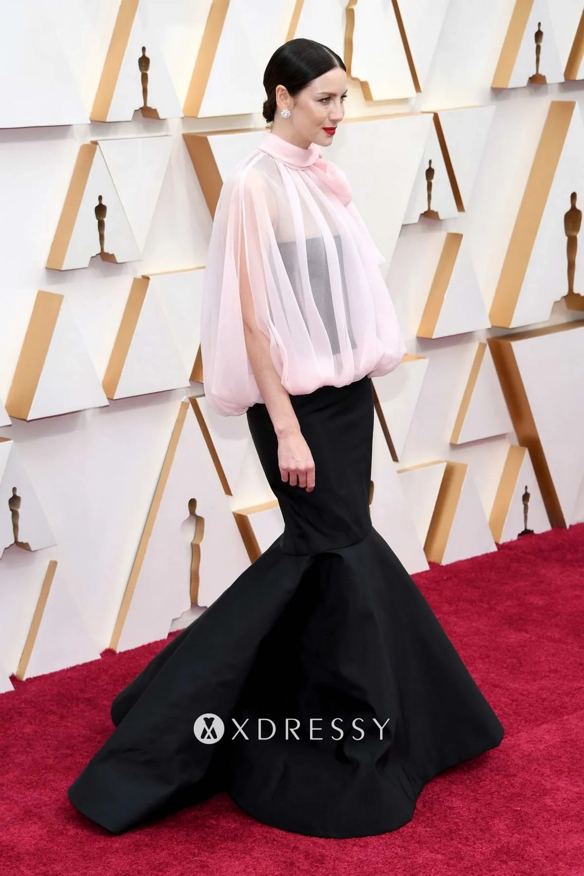 Caitriona Balfe black evening dress with pink blouse at the 2020 Oscars