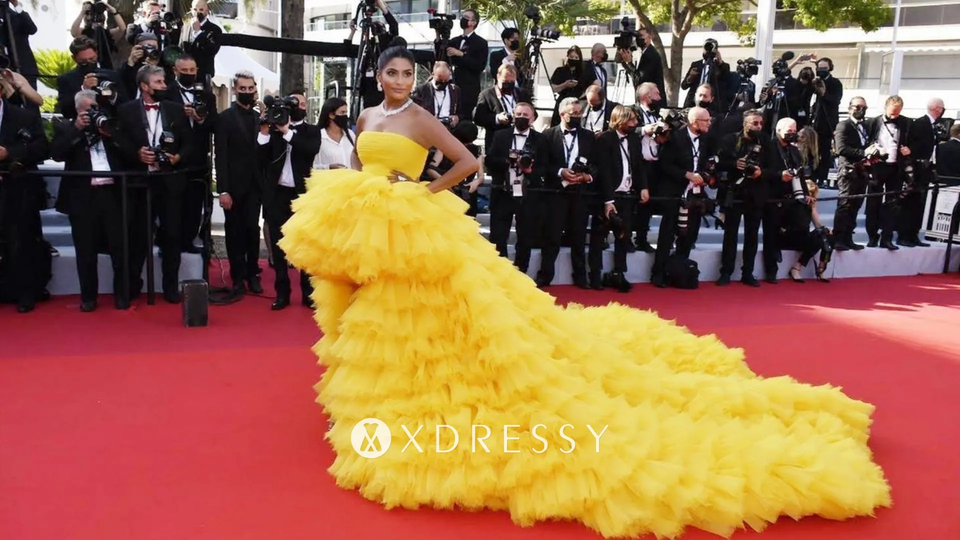 Farhana Bodi canary yellow ruffled long train red carpet dress at 2021 Cannes